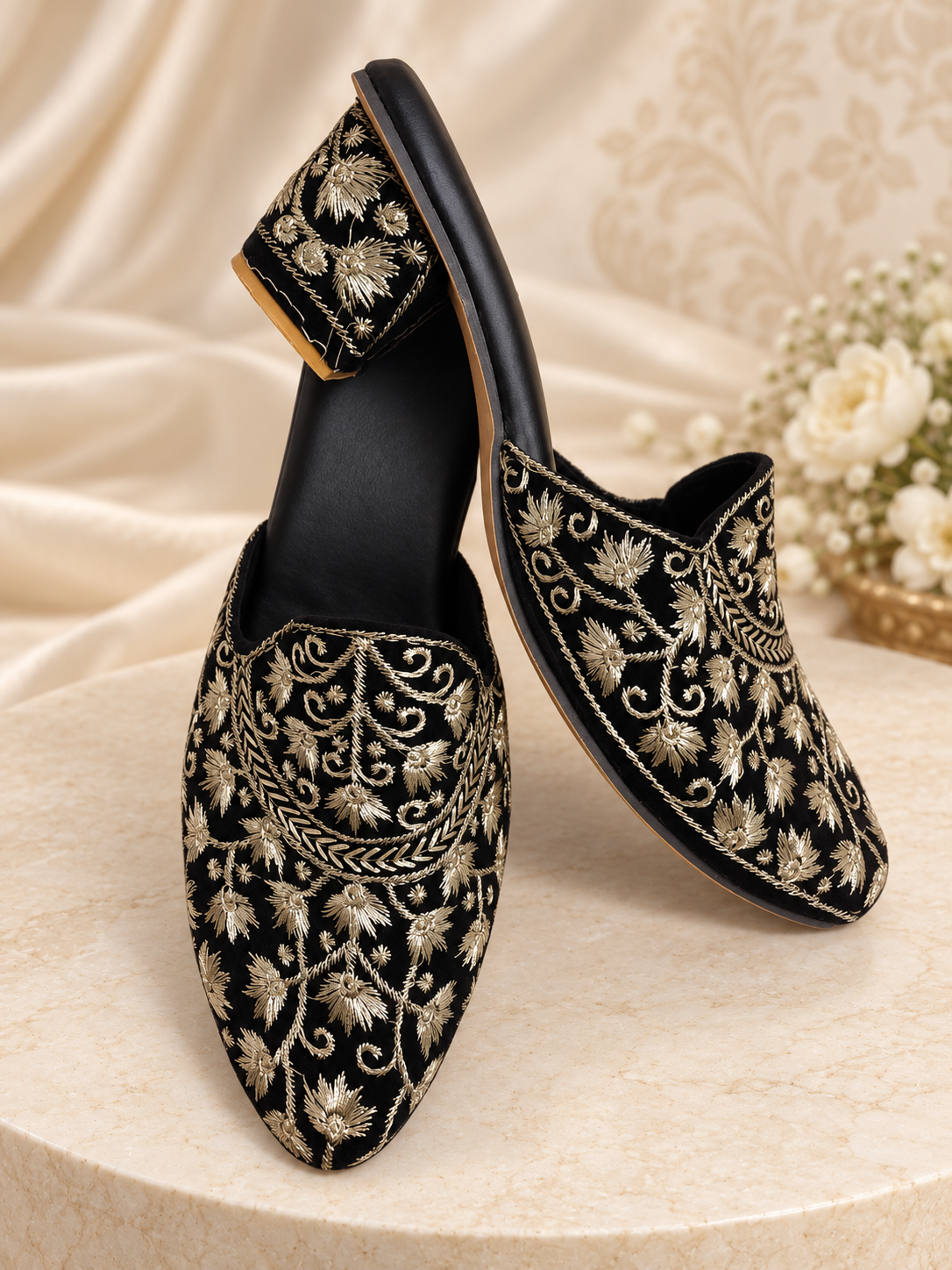 Black embroidered mules for women with gold floral threadwork