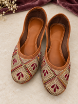 Gold Punjabi jutti for women with burgundy embroidered accents