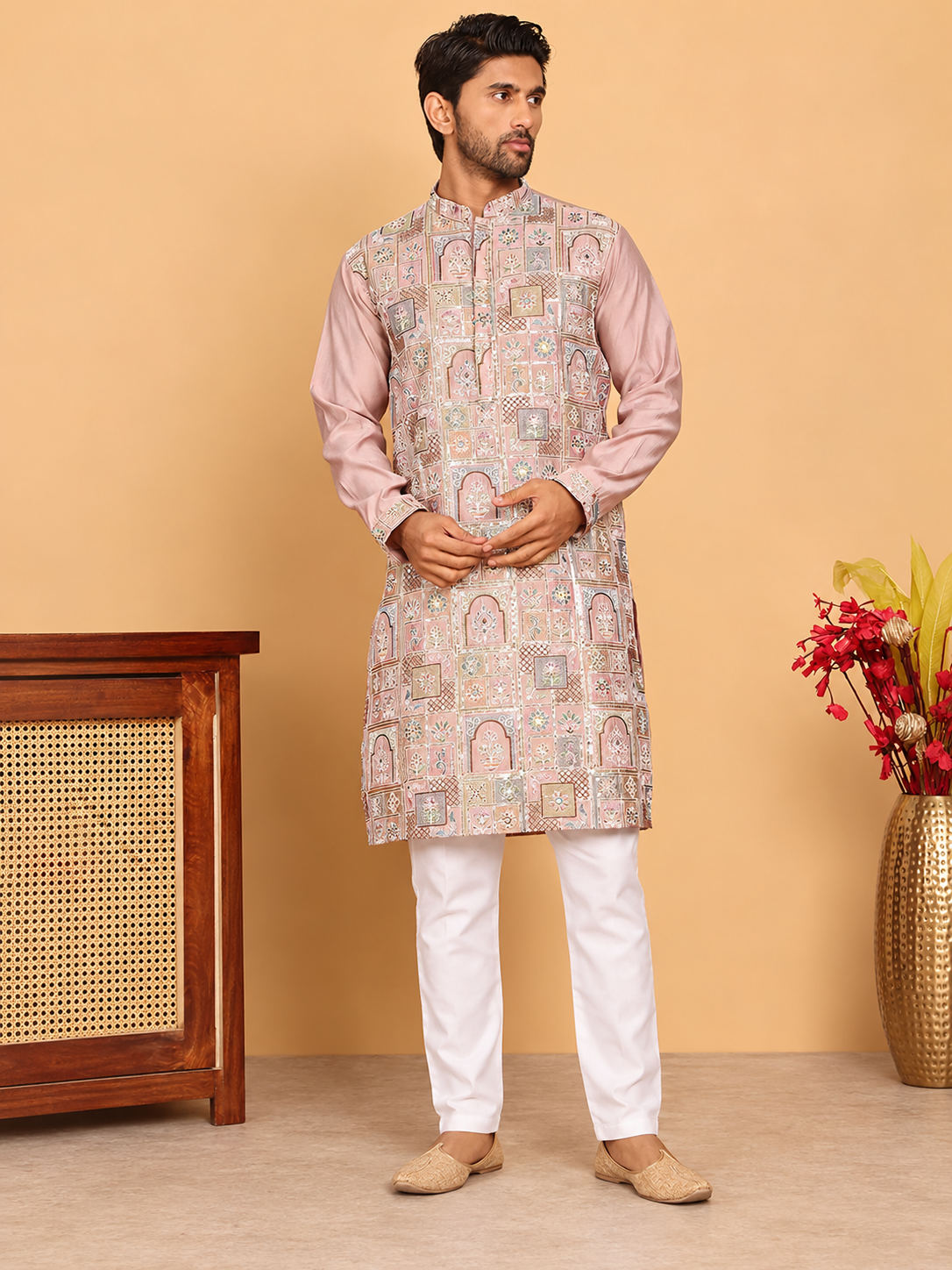 Peach embroidered men's kurta shown full length with white pyjama