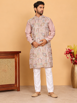 Peach embroidered men's kurta shown full length with white pyjama