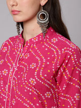 pink patterned shirt with large earrings