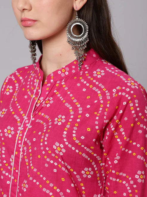 pink patterned shirt with large earrings