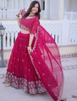 Woman in a pink traditional outfit with a white background