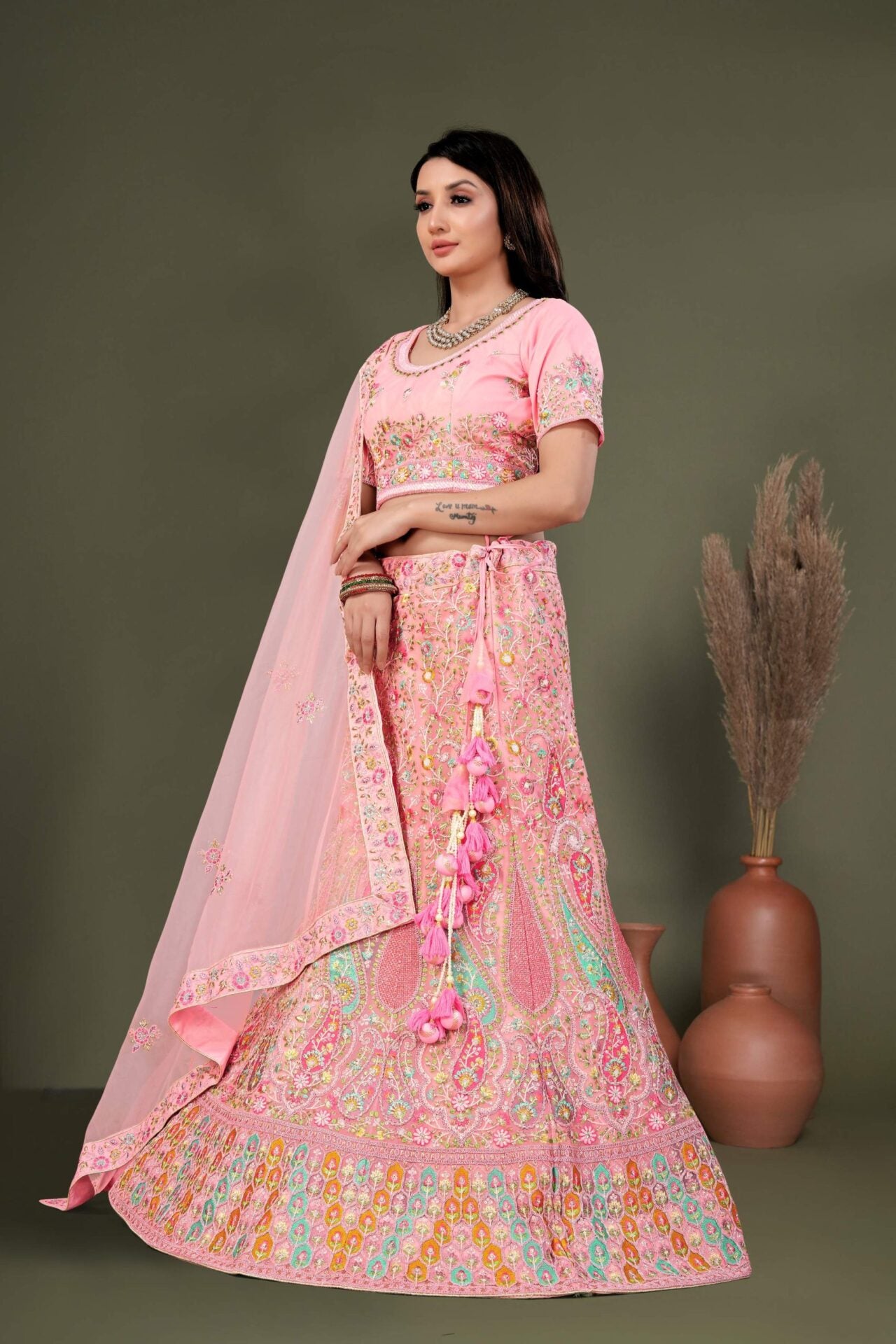 Light Pink Lehenga Choli Embellished With Multicolored Thread Work