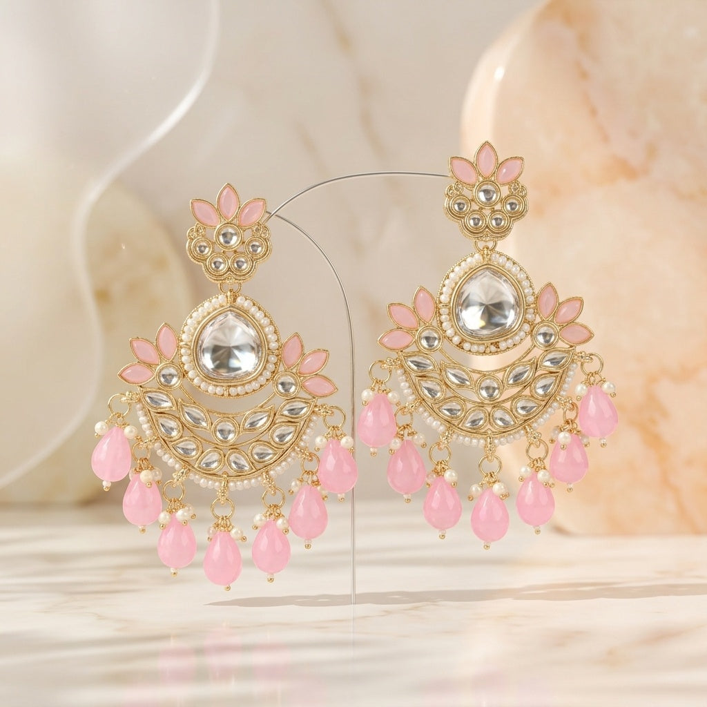 Ornate earrings with pink stones on a soft background