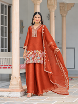 Full-length vibrant copper orange palazzo suit