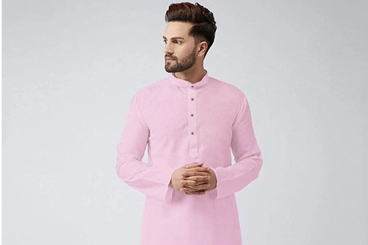 Elegant light pink kurta for men paired with white pajama and brown formal shoes for a sophisticated ethnic look.